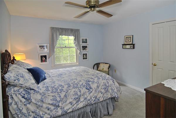 34 Grey Rock Road Bedford, NH 03110 - Photo 18 of 27 a bedroom with a bed and window
