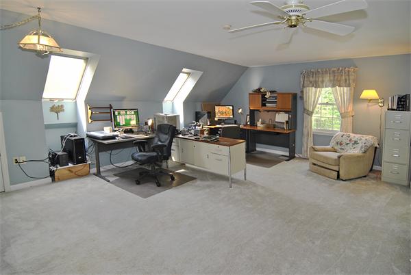 34 Grey Rock Road Bedford, NH 03110 - Photo 20 of 27 a view of a livingroom with workspace and a window