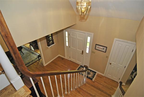 34 Grey Rock Road Bedford, NH 03110 - Photo 2 of 27 a view of a hallway with wooden floor and staircase