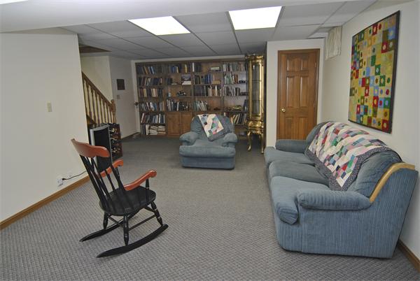 34 Grey Rock Road Bedford, NH 03110 - Photo 22 of 27 a living room with furniture and a window