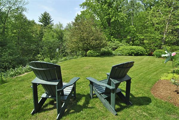 34 Grey Rock Road Bedford, NH 03110 - Photo 26 of 27 a view of a chair and table in the garden