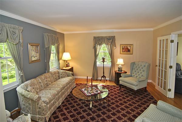 34 Grey Rock Road Bedford, NH 03110 - Photo 3 of 27 a living room with furniture and a large window