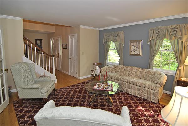 34 Grey Rock Road Bedford, NH 03110 - Photo 4 of 27 a living room with furniture and a large window