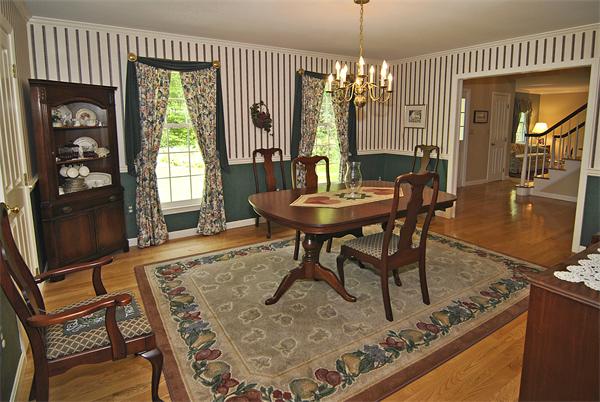 34 Grey Rock Road Bedford, NH 03110 - Photo 5 of 27 a view of a dining room with furniture and window