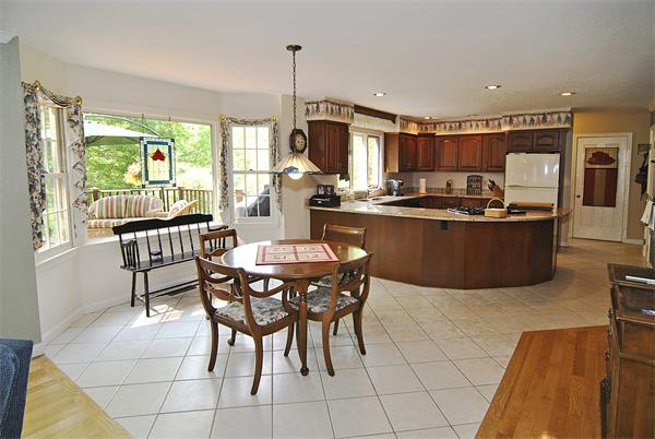 34 Grey Rock Road Bedford, NH 03110 - Photo 8 of 27 a dining room with furniture and large windows