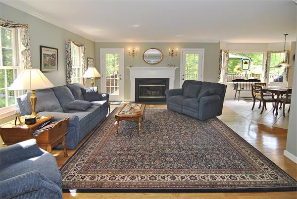 34 Grey Rock Road Bedford, NH 03110 - Photo 10 of 27 a living room with furniture and a fireplace