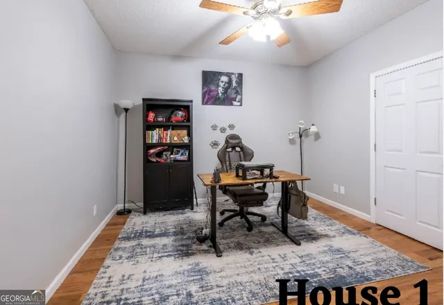 a view of a big yard with plants and a tree