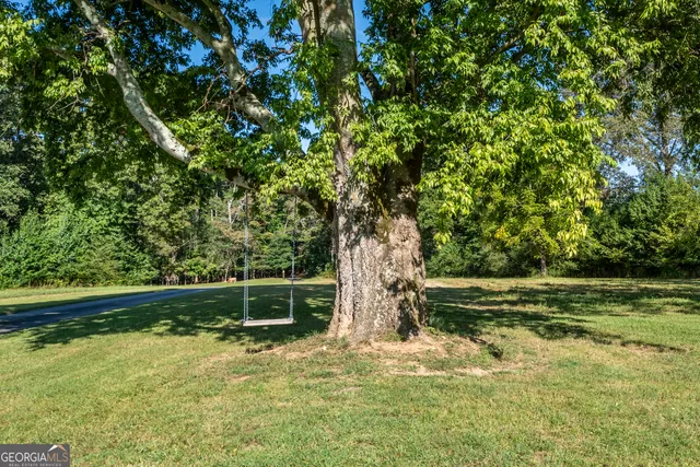 a living room with furniture fireplace and flat screen tv