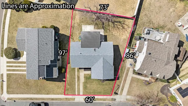 an aerial view of a house with a ocean view