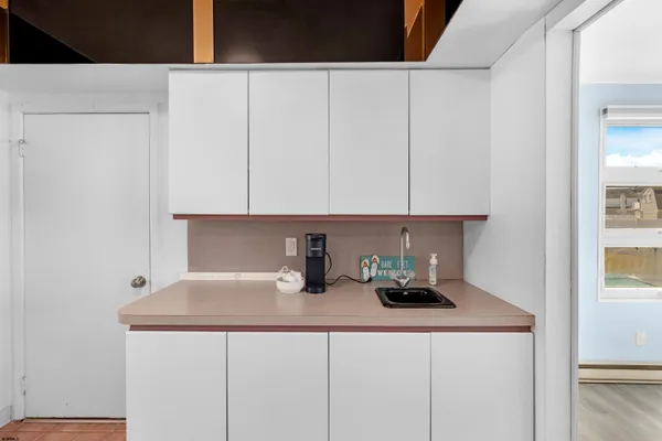 a kitchen with a sink and cabinets