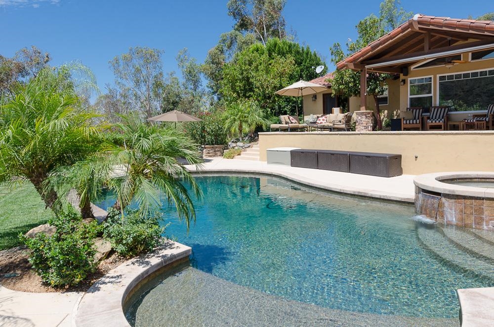 18101 Old Coach Road Poway, CA 92064 - Photo 3 of 25 Pebble tec pool with elevated water fall spa , diving board and views!