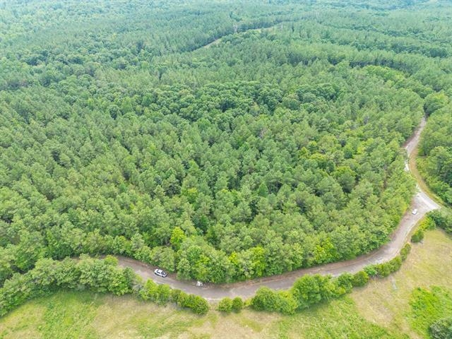3605 Burnett Mills Road Bolivar, TN 38008 - Photo 7 of 9 an aerial view of residential house with outdoor space and trees all around
