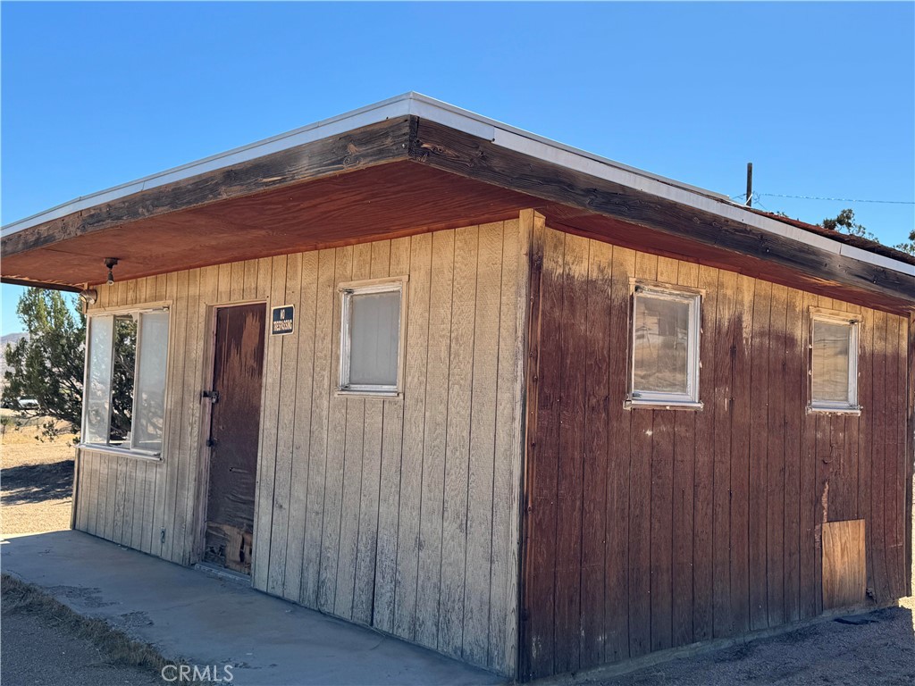 23766 Valley View Road Apple Valley, CA 92308 - Photo 3 of 13 a view of wooden door