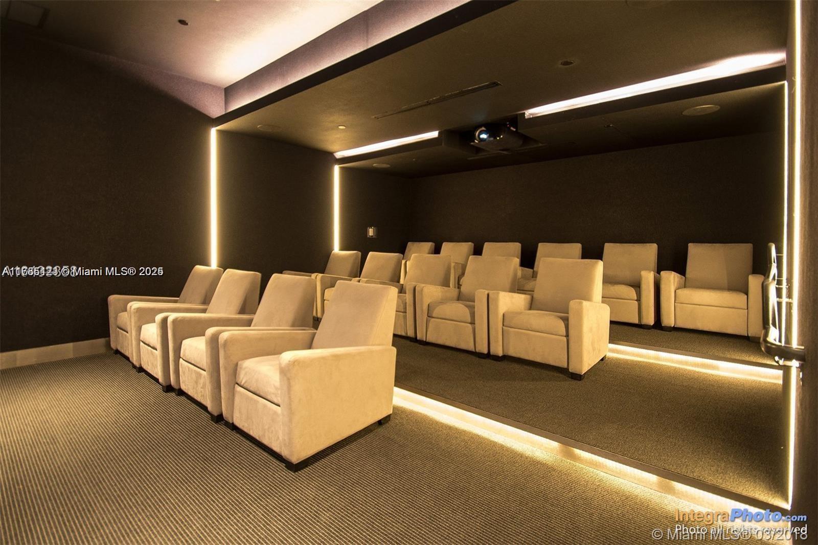 18555 Collins Avenue, Unit 701 Sunny Isles Beach, FL 33160 - Photo 15 of 21 a living room with furniture and a lamp