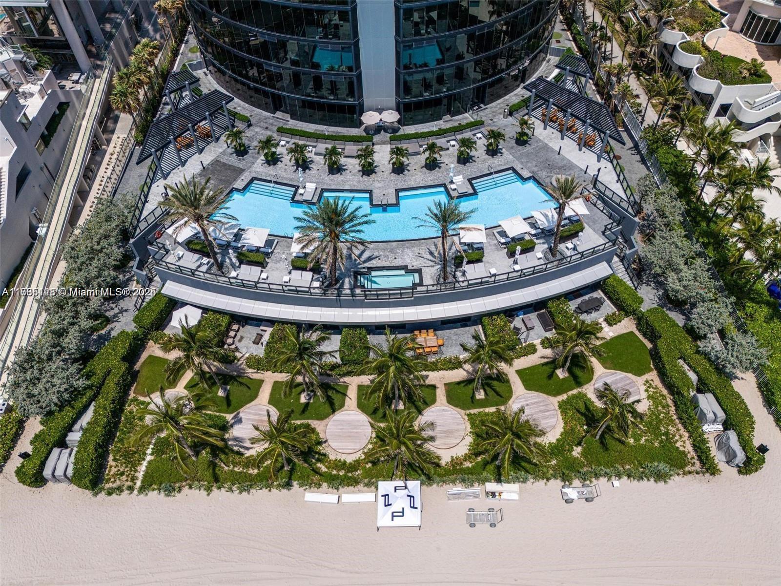 18555 Collins Avenue, Unit 701 Sunny Isles Beach, FL 33160 - Photo 20 of 21 a view of swimming pool yard