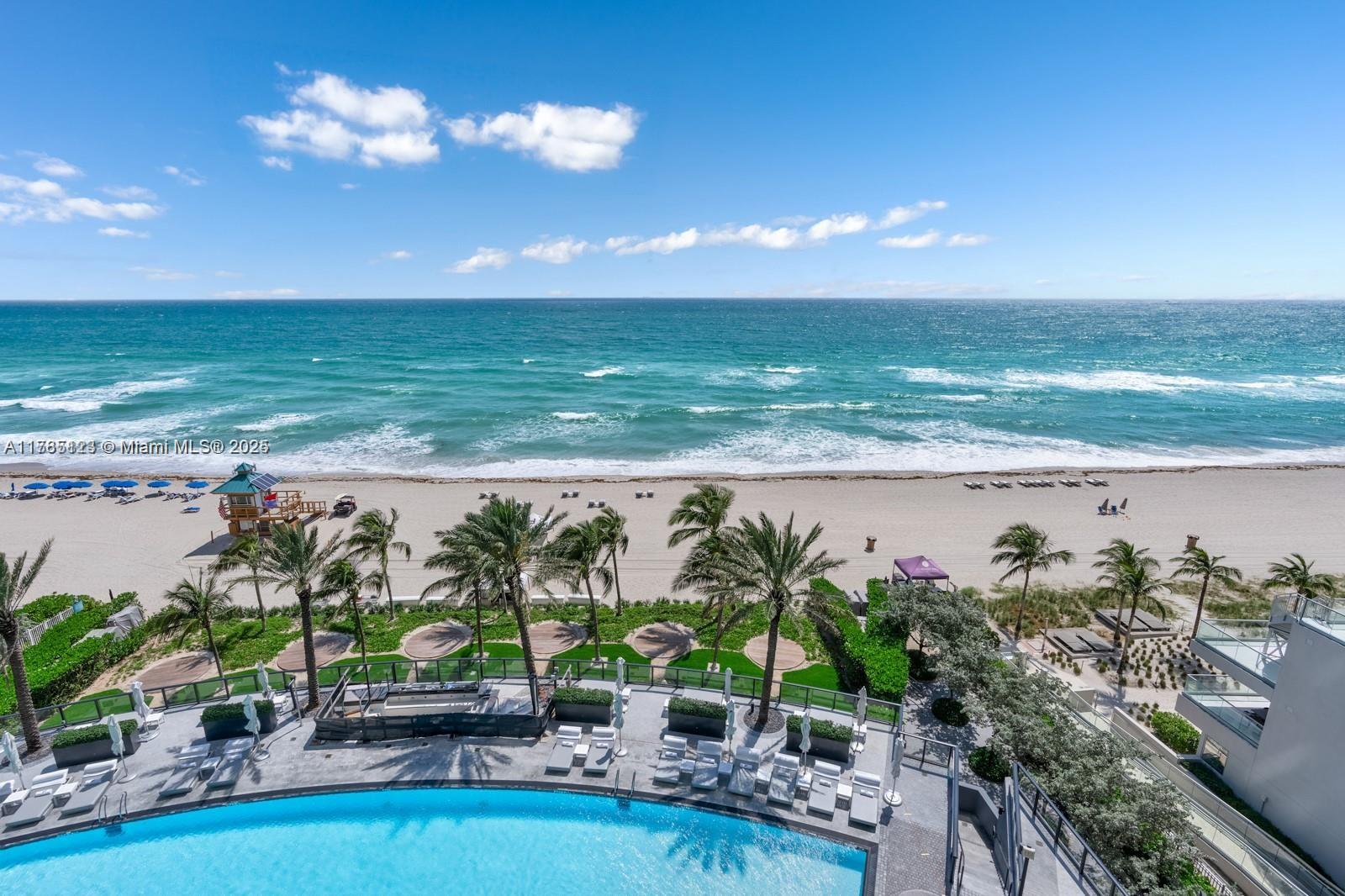18555 Collins Avenue, Unit 701 Sunny Isles Beach, FL 33160 - Photo 9 of 21 a view of a an ocean from a balcony