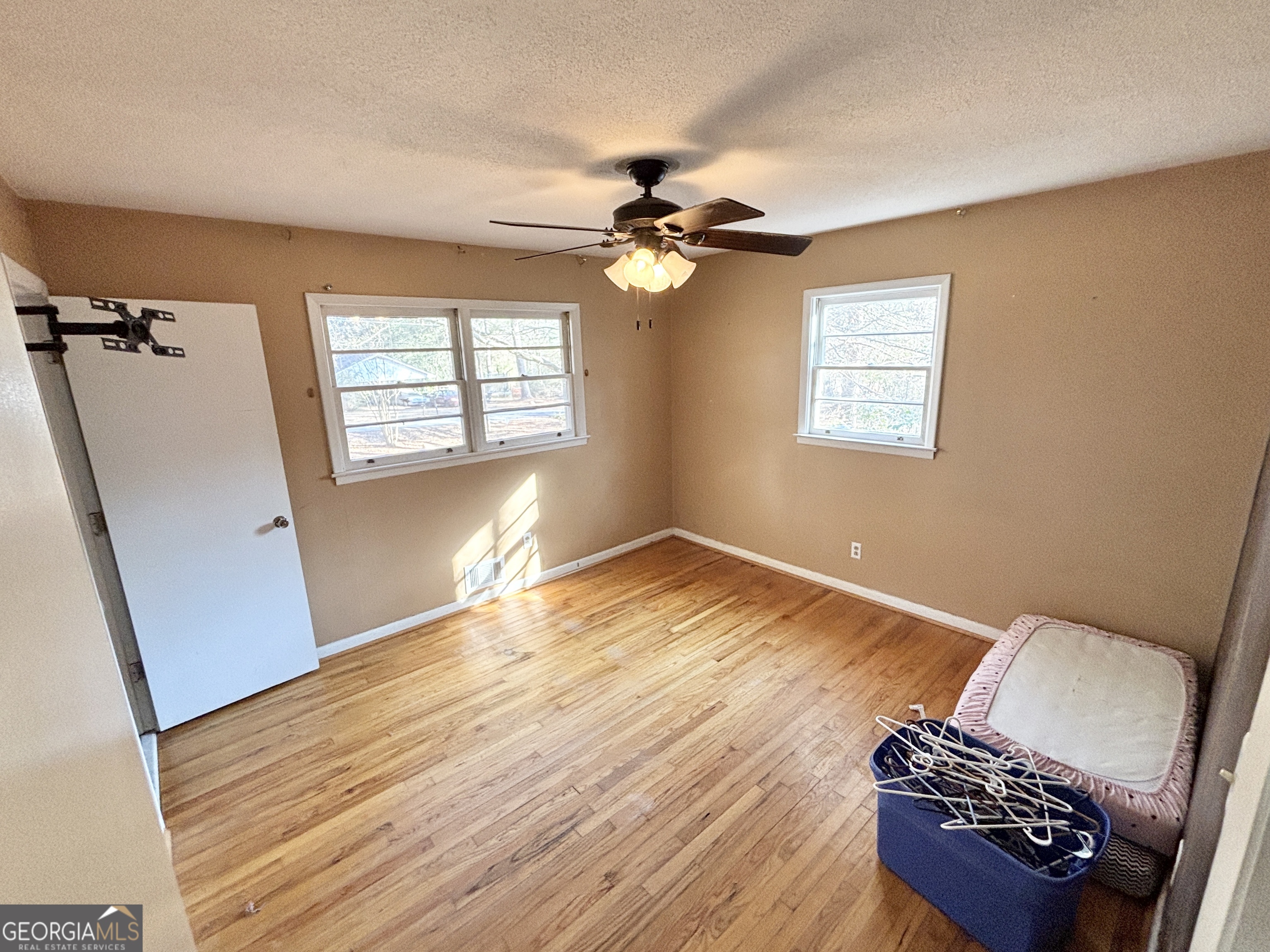 210 Arrowhead Road Athens, GA 30606 - Photo 11 of 15 wooden floor in an empty room with a window