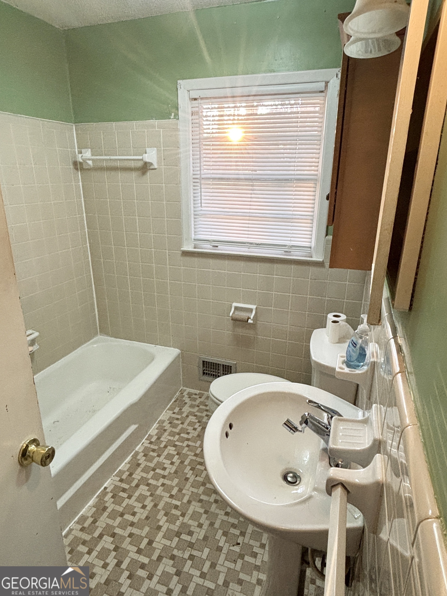 210 Arrowhead Road Athens, GA 30606 - Photo 8 of 15 a bathroom with a sink and a mirror