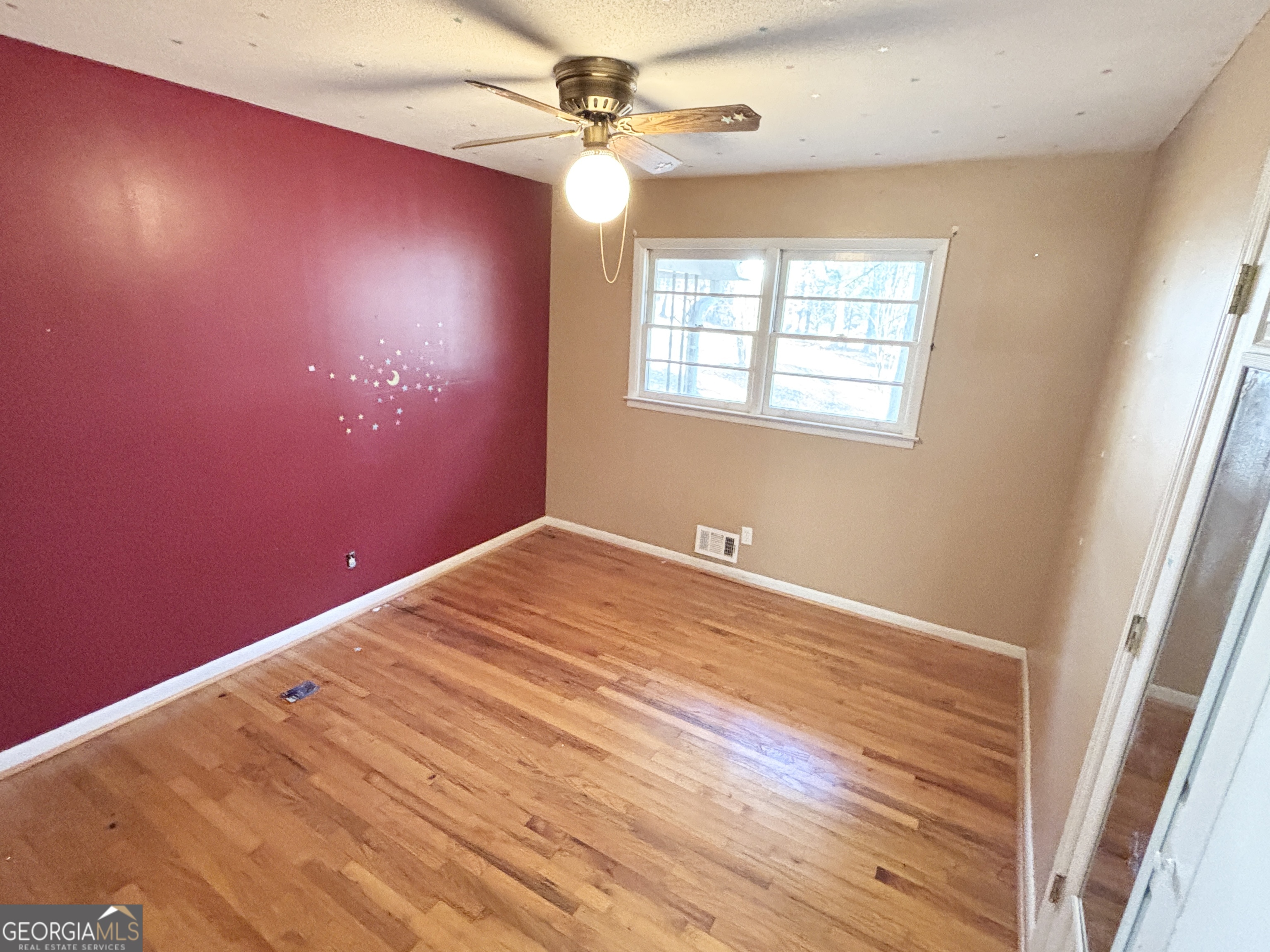 210 Arrowhead Road Athens, GA 30606 - Photo 9 of 15 an empty room with windows and fan