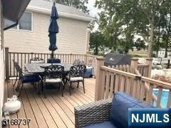 a view of a chairs and table on the deck