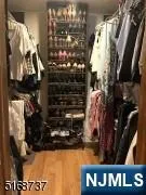 a view of a patio with couches chairs and a wooden floor