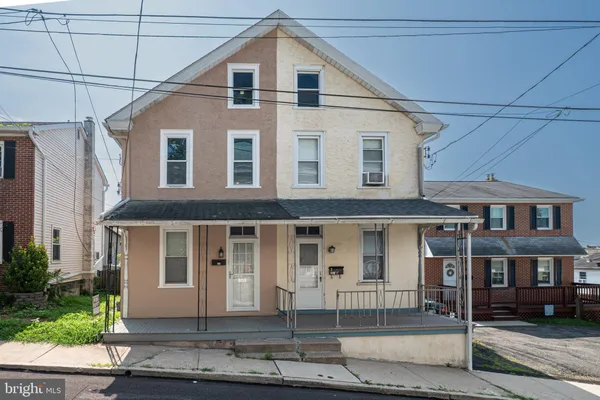a front view of a house with a porch