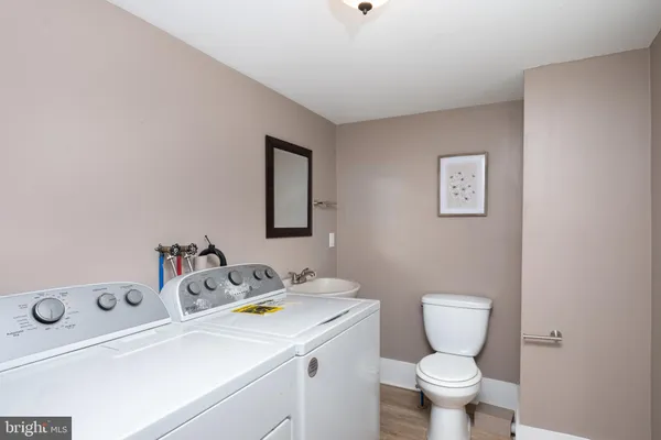 a bathroom with a sink toilet and vanity