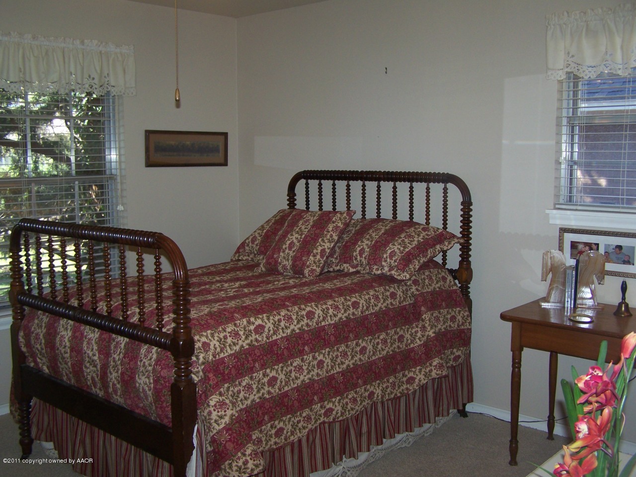 6113 Dreyfuss Road Amarillo, TX 79106 - Photo 17 of 27 a large bed sitting in a bedroom next to a window