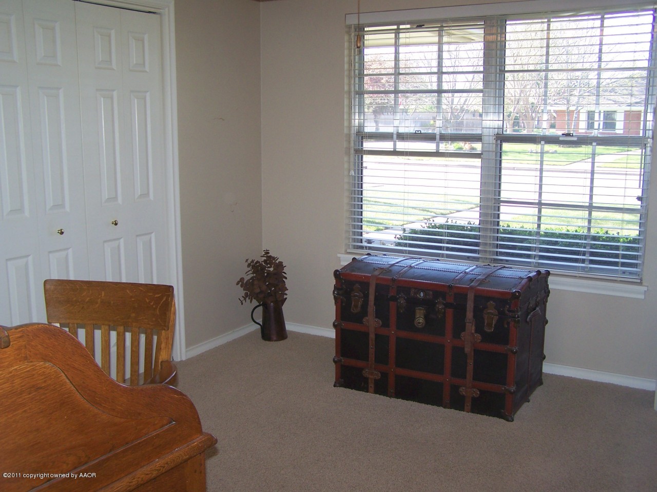 6113 Dreyfuss Road Amarillo, TX 79106 - Photo 18 of 27 a view of a bedroom with a bed and a window