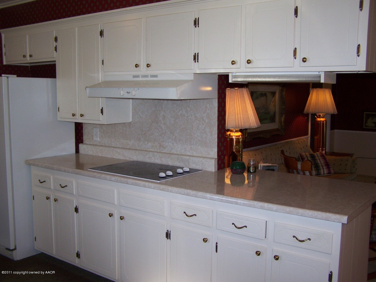 6113 Dreyfuss Road Amarillo, TX 79106 - Photo 8 of 27 a kitchen with white cabinets and sink