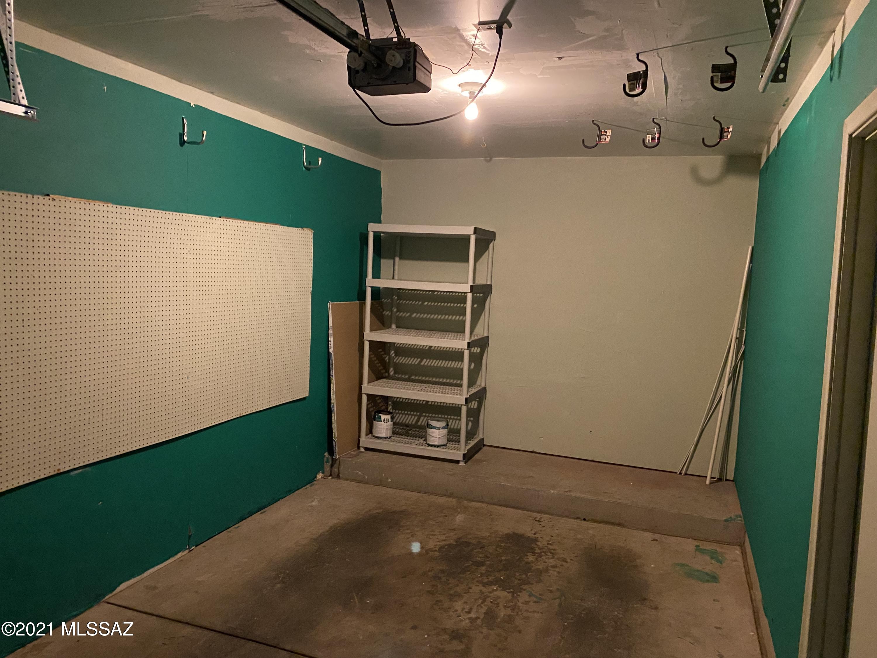 210 East Pastime Road Tucson, AZ 85705 - Photo 4 of 29 a view of an empty room with a kitchen