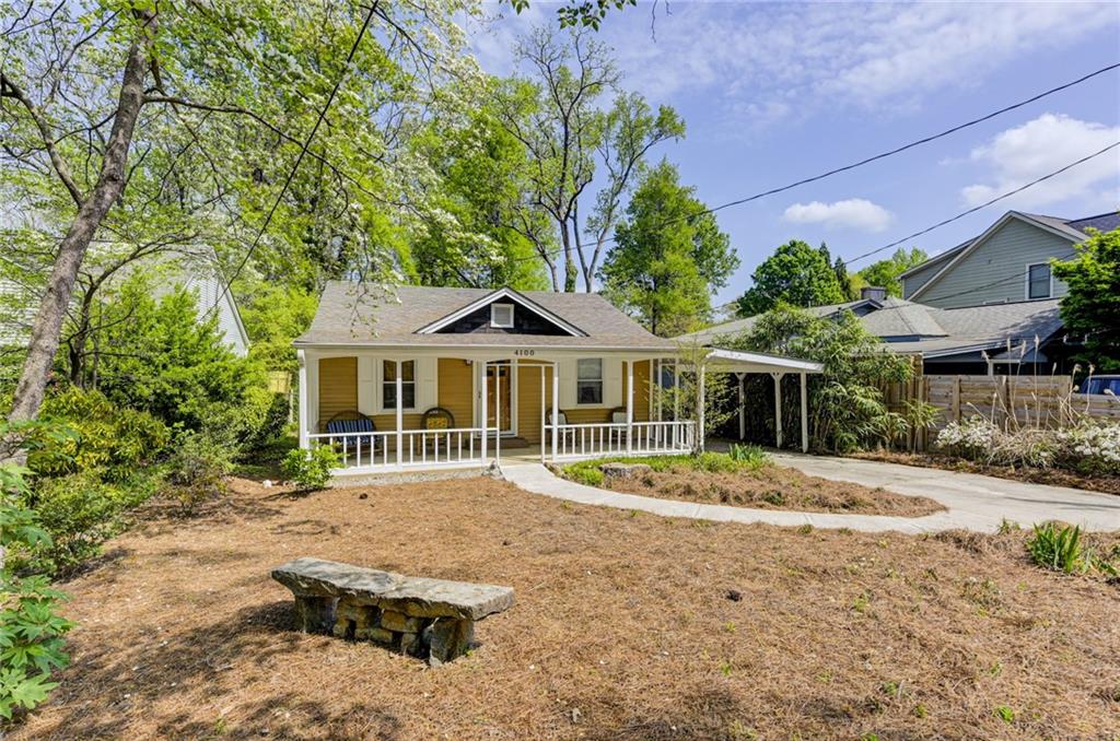 4100 Adrian Street Tucker, GA 30084 - Photo 1 of 23 a house with trees in the background