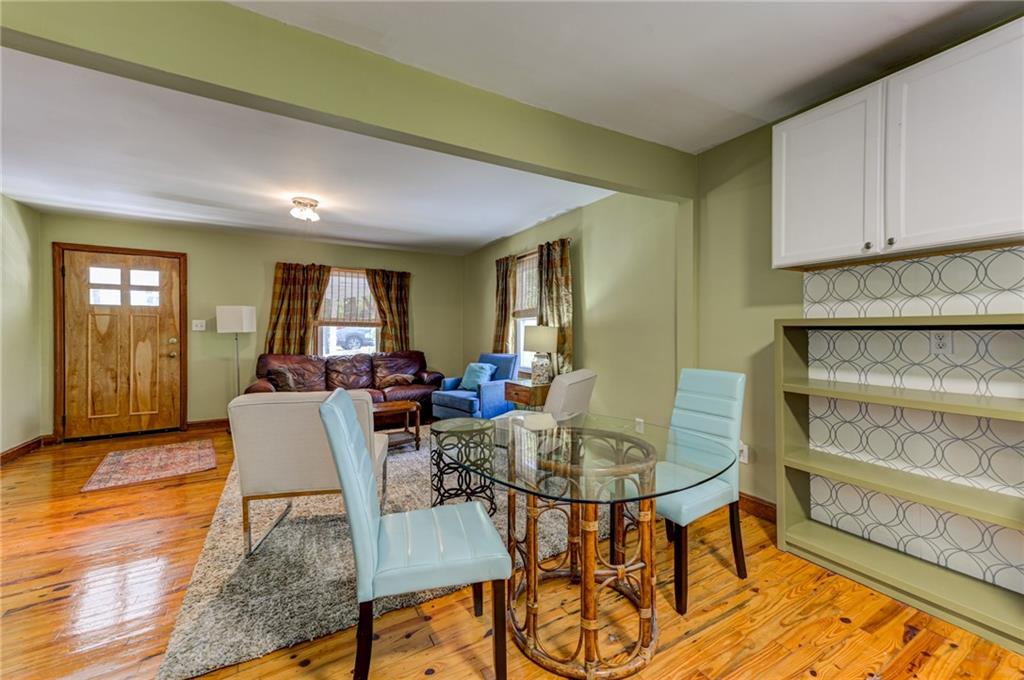 4100 Adrian Street Tucker, GA 30084 - Photo 11 of 23 a living room with dining room and wooden floor