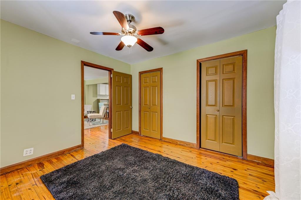 4100 Adrian Street Tucker, GA 30084 - Photo 14 of 23 a bedroom with a bed and a chandelier