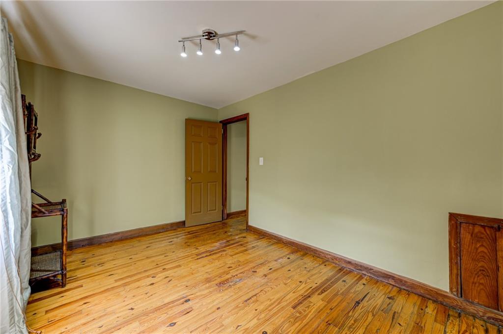 4100 Adrian Street Tucker, GA 30084 - Photo 18 of 23 a view of empty room with wooden floor and fan