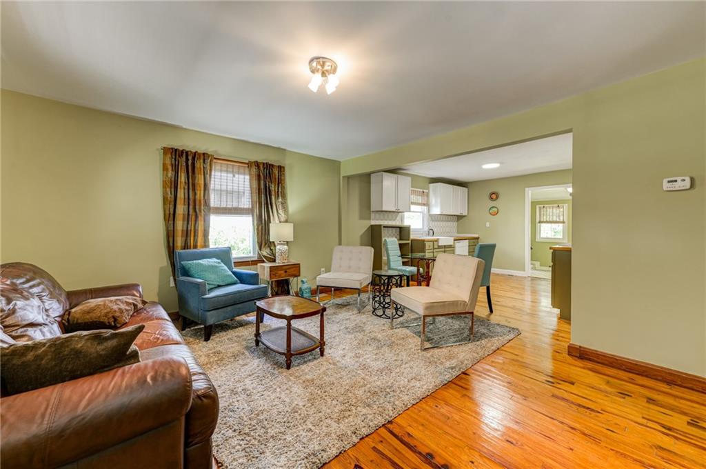 4100 Adrian Street Tucker, GA 30084 - Photo 3 of 23 a living room with furniture and a wooden floor