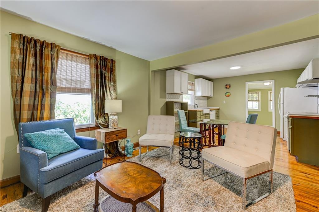 4100 Adrian Street Tucker, GA 30084 - Photo 5 of 23 a living room with furniture and a flat screen tv