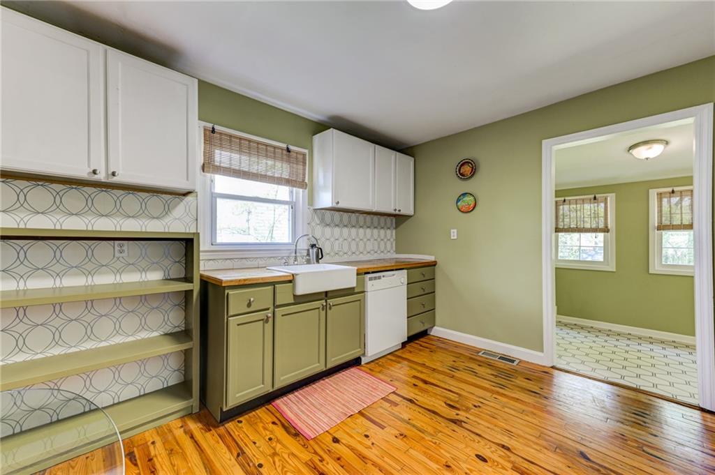 4100 Adrian Street Tucker, GA 30084 - Photo 8 of 23 a kitchen with a sink and cabinets