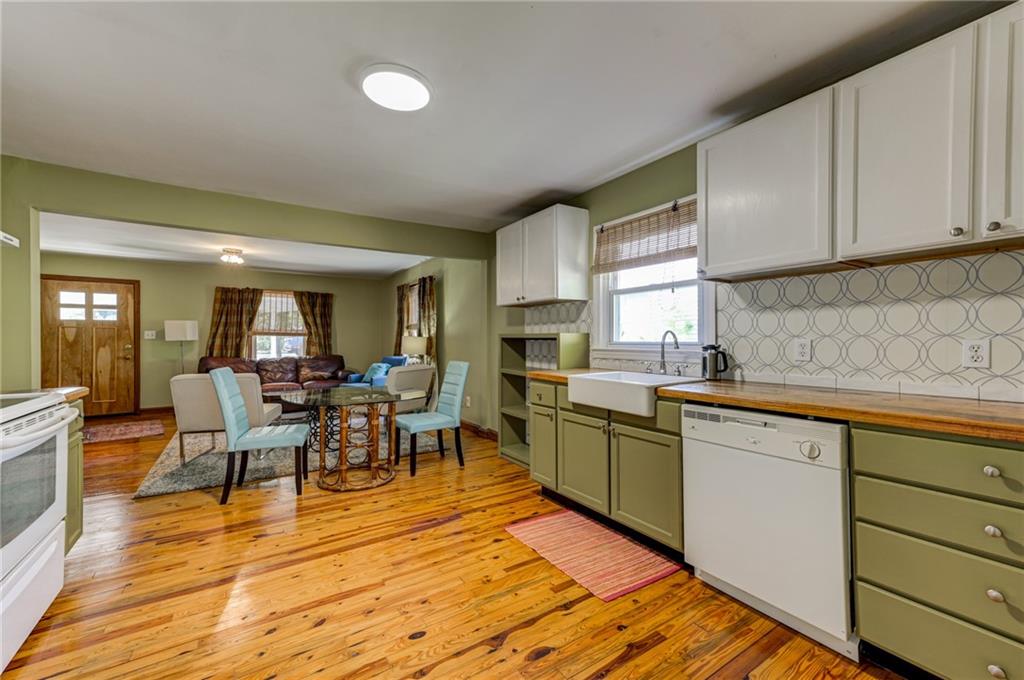4100 Adrian Street Tucker, GA 30084 - Photo 10 of 23 a open kitchen with sink cabinets and wooden floor