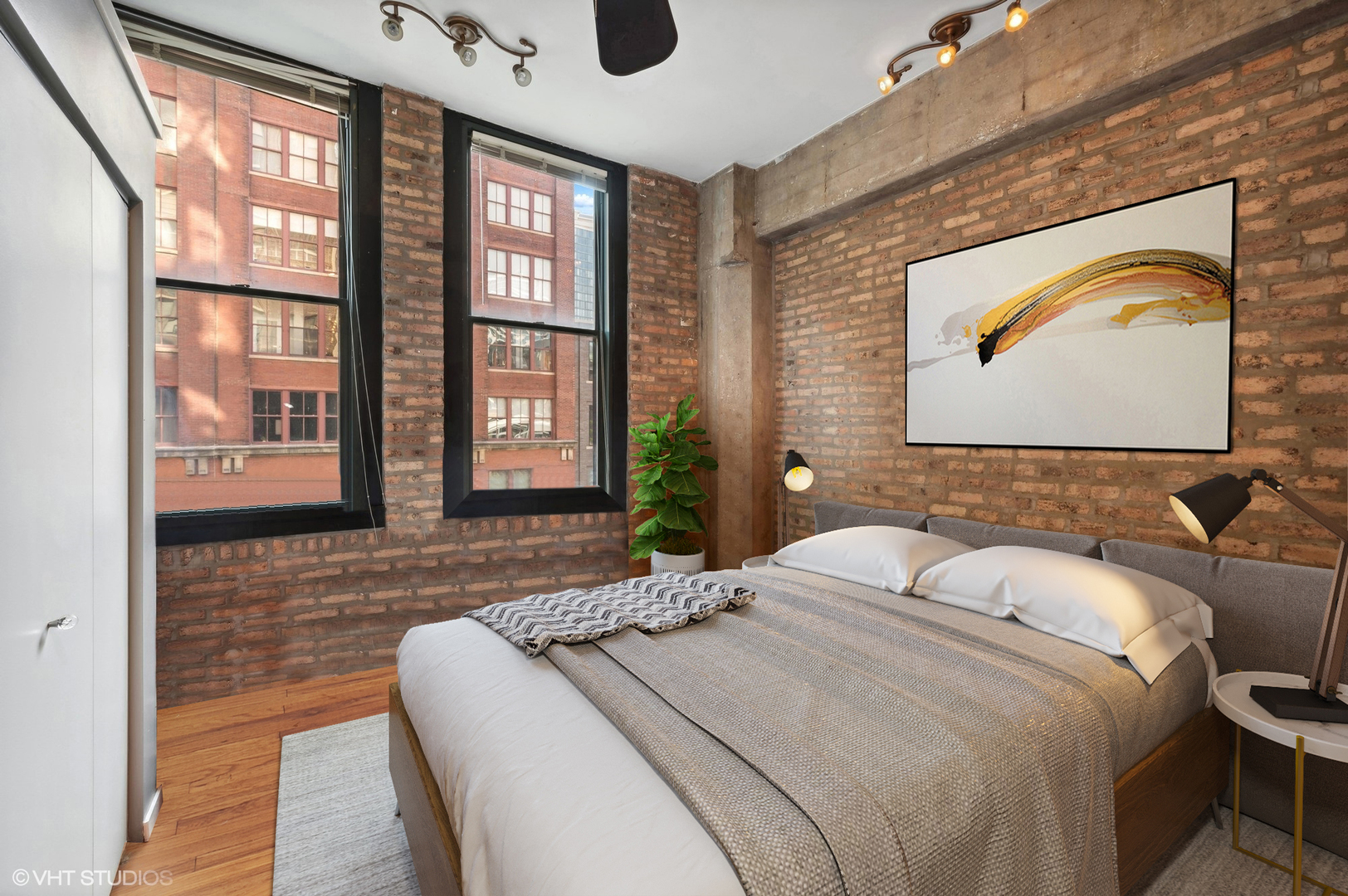720 South Dearborn Street, Unit 305 Chicago, IL 60605 - Photo 11 of 20 a bedroom with a bed and a painting on the wall