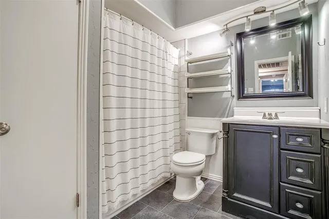a bathroom with a toilet and a sink