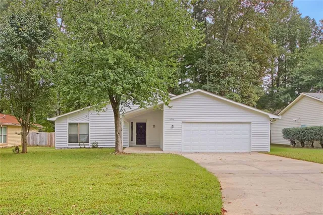 front view of a house with a yard