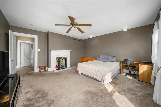 a bed room with a bed and a tv