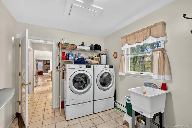 a utility room with dryer and washer
