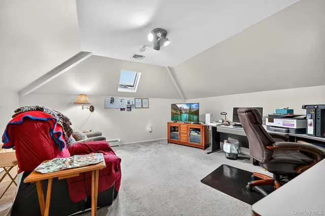 a bedroom with furniture and a chandelier