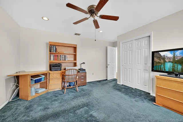 a view of workspace with furniture and window