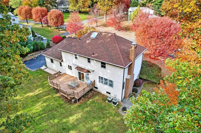 a view of a yard with a house and trees