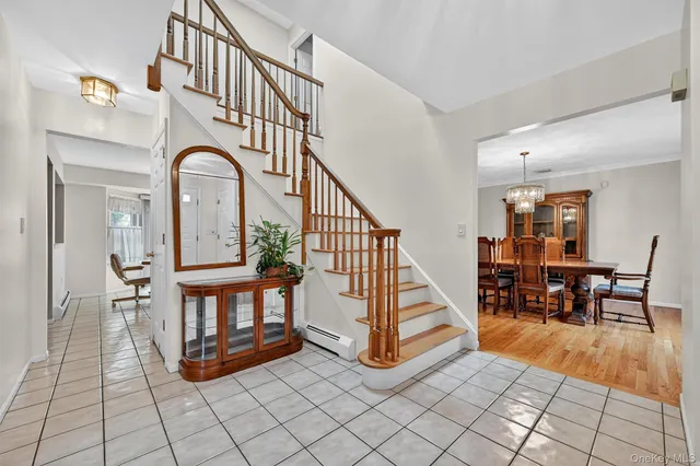 a view of entryway and hall with dining room