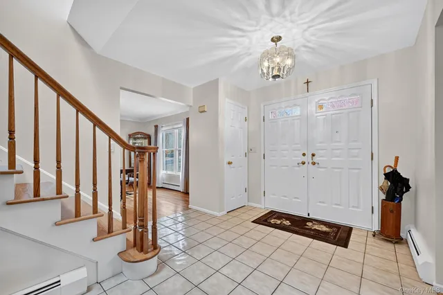 a view of an entryway with chandelier