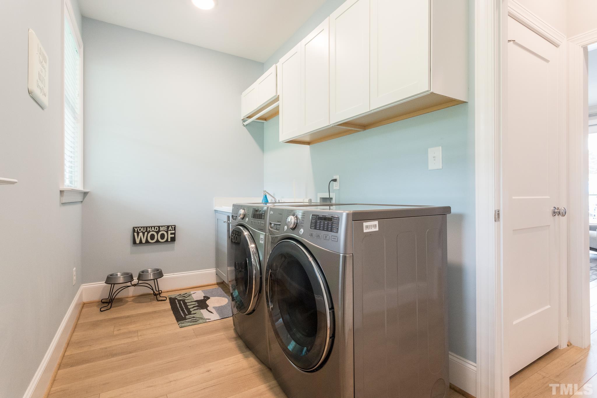 9117 Penny Road Raleigh, NC 27606 - Photo 16 of 54 a utility room with dryer and washer